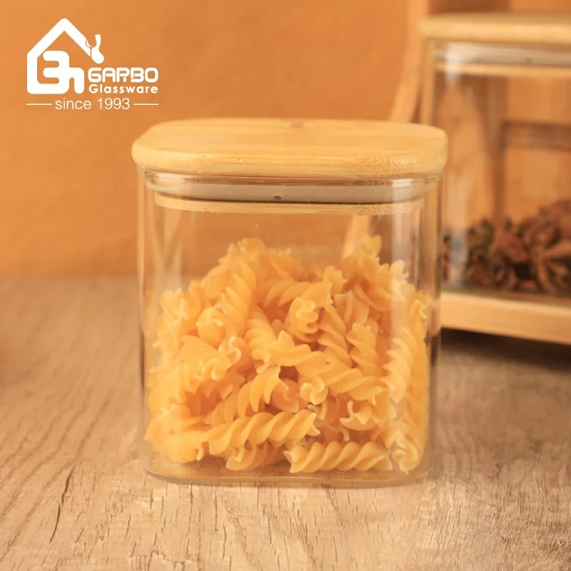 China Supplier High Borosilicate Glass Jars for  Kitchen or Home Storage Bottle Sets  with Bamboo Lids and Stand Customized